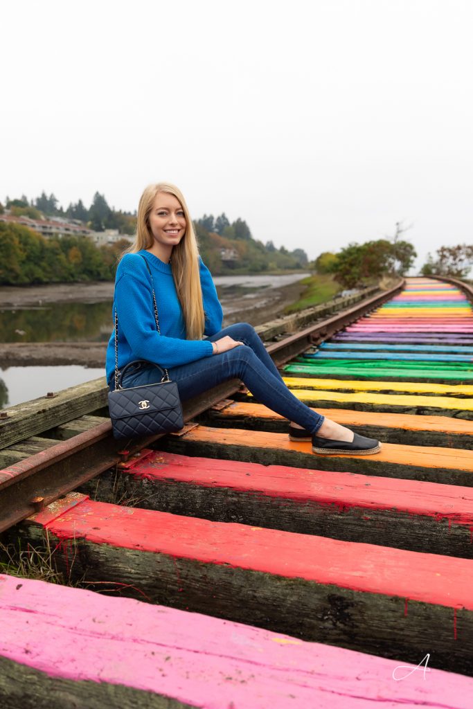 rainbow railroad colorful outfit blue sweater